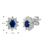 Oorknoppen met Saffier 1.08ct (2x 0.54ct) en Zirkonia Halo, 14 Karaat Witgoud - Formaat 7.5x8.5mm